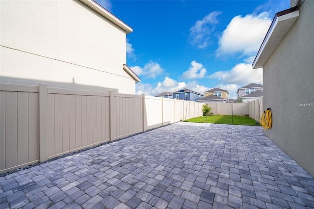 2463 Volunteer Ave, Kissimmee, FL 34744 - fenced backyard featuring a patio area