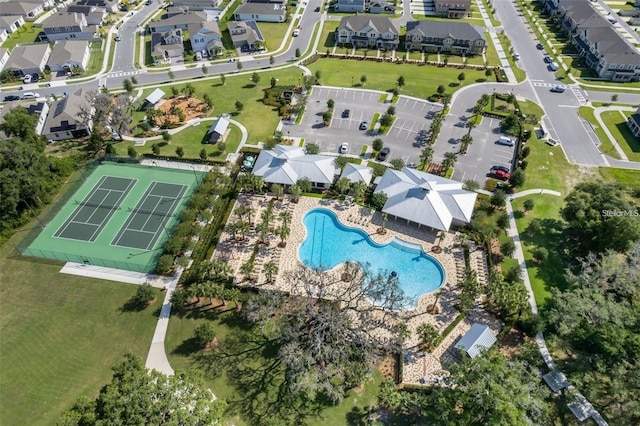2463 Volunteer Ave, Kissimmee, FL 34744 - aerial view of property's location featuring a pool area and nearby suburban area