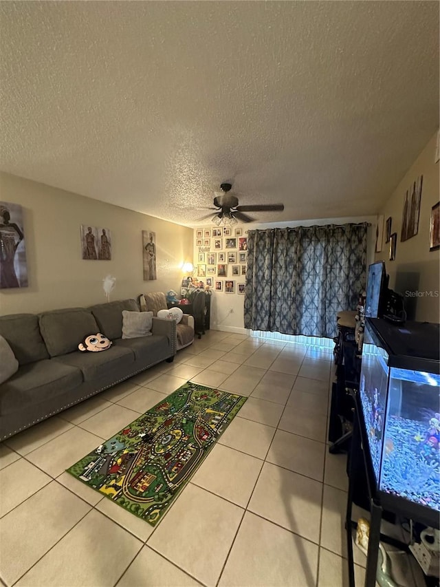 1932 Lake Atriums Cir Unit 78, Orlando, FL 32839 - tiled living room with ceiling fan and a textured ceiling