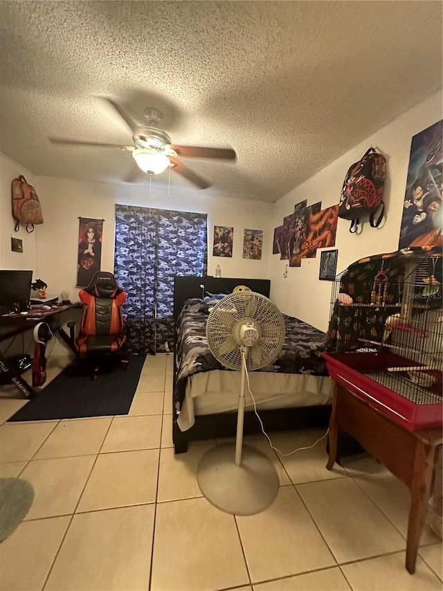 1932 Lake Atriums Cir Unit 78, Orlando, FL 32839 - tiled bedroom with a textured ceiling, a ceiling fan, and a desk