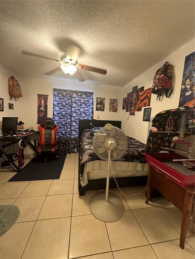 1932 Lake Atriums Cir Unit 78, Orlando, FL 32839 - tiled bedroom with a textured ceiling, a ceiling fan, and a desk