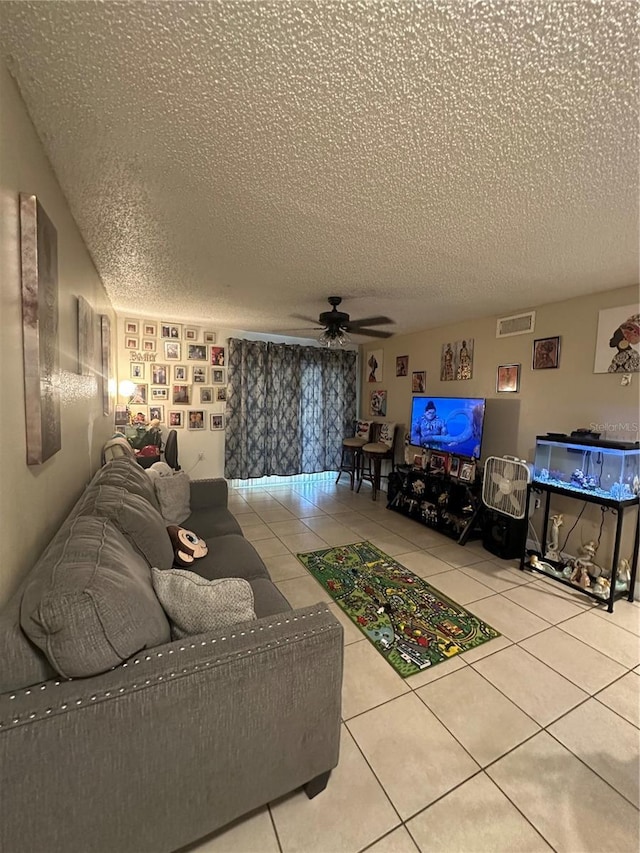 1932 Lake Atriums Cir Unit 78, Orlando, FL 32839 - living area featuring a textured ceiling, tile patterned flooring, and a ceiling fan