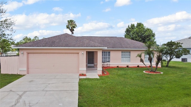 314 Clermont Dr, Kissimmee, FL 34759 - ranch-style home featuring stucco siding, roof with shingles, concrete driveway, a front lawn, and an attached garage