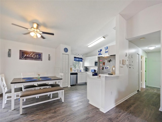314 Clermont Dr, Kissimmee, FL 34759 - kitchen with stainless steel appliances, dark wood finished floors, white cabinets, light countertops, and ceiling fan