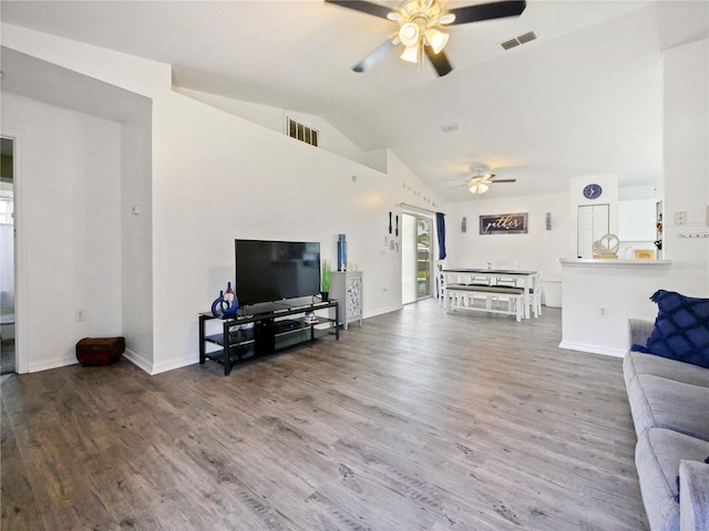 314 Clermont Dr, Kissimmee, FL 34759 - living room featuring a ceiling fan, wood finished floors, and vaulted ceiling