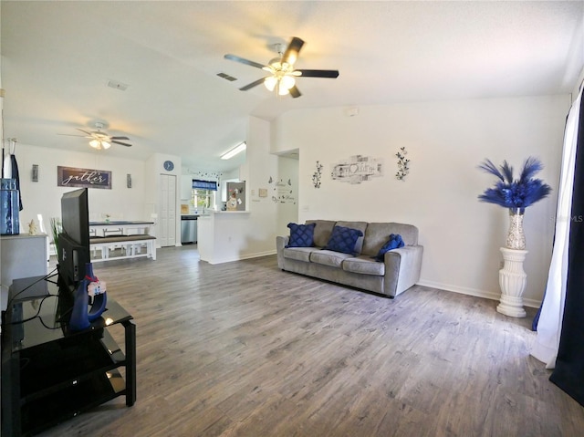 314 Clermont Dr, Kissimmee, FL 34759 - living area with a ceiling fan, wood finished floors, and vaulted ceiling