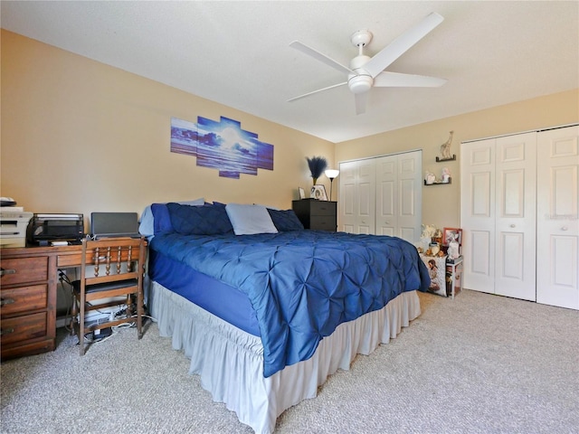 314 Clermont Dr, Kissimmee, FL 34759 - carpeted bedroom featuring multiple closets, ceiling fan, and a desk