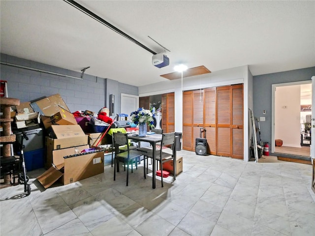 314 Clermont Dr, Kissimmee, FL 34759 - garage featuring a garage door opener and concrete block wall