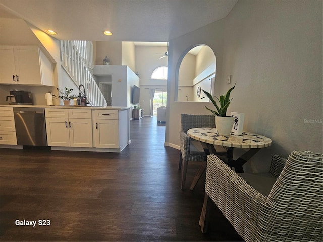 407 Darlington Loop, Davenport, FL 33896 - kitchen with dishwasher, a peninsula, dark wood finished floors, white cabinetry, and recessed lighting