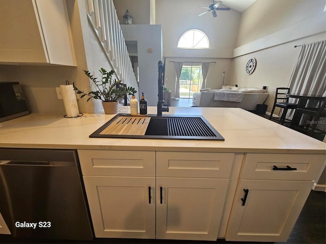 407 Darlington Loop, Davenport, FL 33896 - kitchen with dishwasher, a high ceiling, open floor plan, ceiling fan, and a peninsula