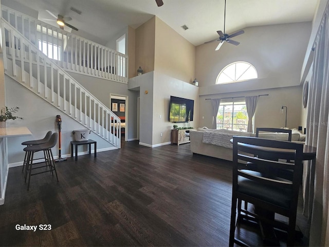 407 Darlington Loop, Davenport, FL 33896 - living room with a ceiling fan, high vaulted ceiling, wood finished floors, and stairway