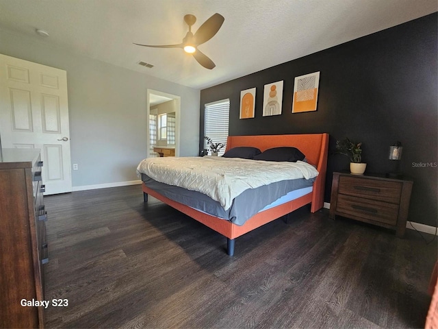 407 Darlington Loop, Davenport, FL 33896 - bedroom featuring wood finished floors, a ceiling fan, and ensuite bathroom