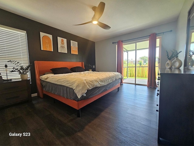 407 Darlington Loop, Davenport, FL 33896 - bedroom featuring access to outside, dark wood finished floors, and a ceiling fan