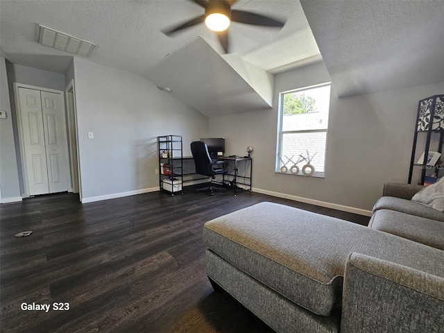 407 Darlington Loop, Davenport, FL 33896 - bedroom with dark wood finished floors, a textured ceiling, vaulted ceiling, a desk, and a ceiling fan