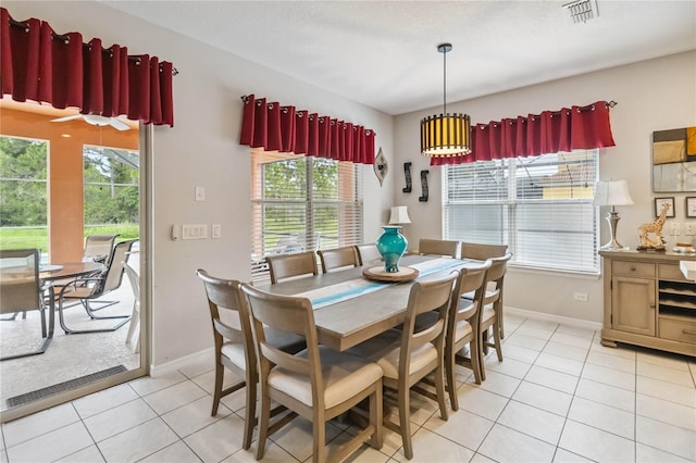163 Tigerlily Ct, Davenport, FL 33837 - dining space with light tile patterned flooring and baseboards