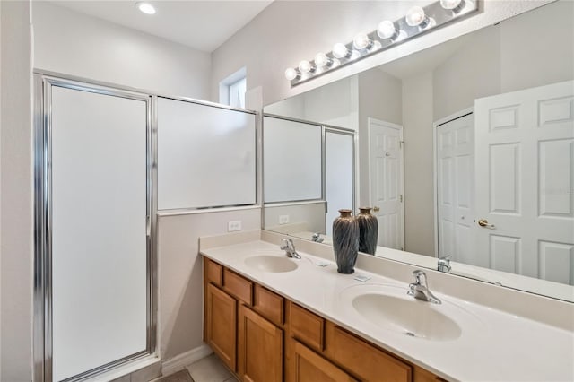 163 Tigerlily Ct, Davenport, FL 33837 - full bathroom featuring a stall shower, double vanity, and tile patterned floors