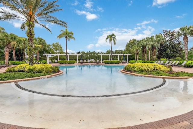 163 Tigerlily Ct, Davenport, FL 33837 - community pool featuring a pergola