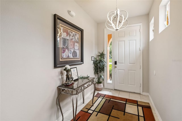 163 Tigerlily Ct, Davenport, FL 33837 - tiled foyer with a chandelier and plenty of natural light