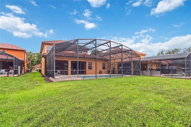 163 Tigerlily Ct, Davenport, FL 33837 - back of house with an outdoor pool, a lawn, and stucco siding