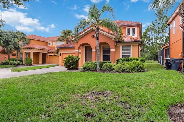 163 Tigerlily Ct, Davenport, FL 33837 - mediterranean / spanish-style home with a tiled roof, concrete driveway, stucco siding, a front yard, and a garage