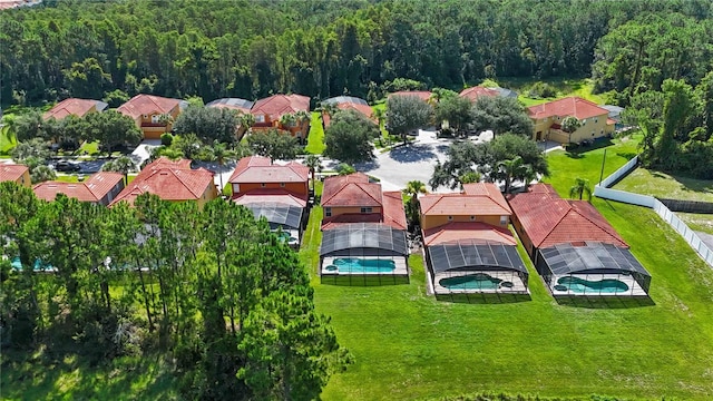 163 Tigerlily Ct, Davenport, FL 33837 - aerial perspective of suburban area with a forest and a pool