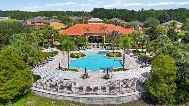 163 Tigerlily Ct, Davenport, FL 33837 - community pool featuring a pergola