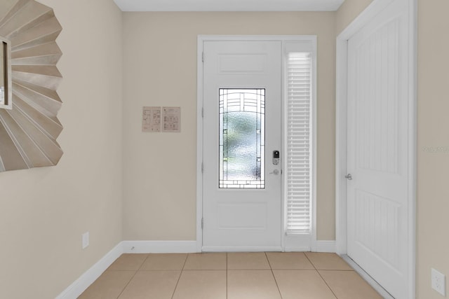 7403 Marker Ave, Kissimmee, FL 34747 - tiled foyer entrance featuring baseboards