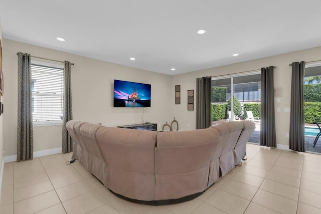 7403 Marker Ave, Kissimmee, FL 34747 - living room with light tile patterned floors and recessed lighting