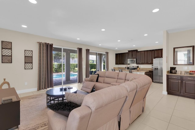 7403 Marker Ave, Kissimmee, FL 34747 - living room featuring light tile patterned floors and recessed lighting