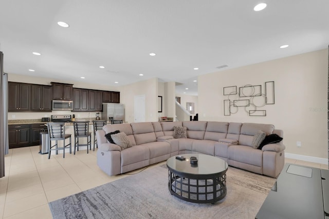 7403 Marker Ave, Kissimmee, FL 34747 - living area featuring recessed lighting and light tile patterned floors