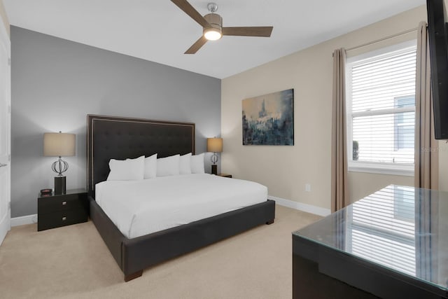 7403 Marker Ave, Kissimmee, FL 34747 - bedroom with light carpet and ceiling fan