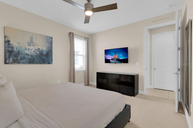 7403 Marker Ave, Kissimmee, FL 34747 - carpeted bedroom with ceiling fan and tile patterned flooring