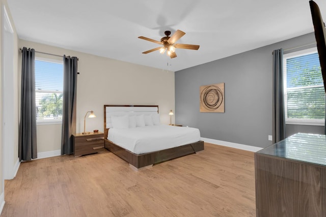 7403 Marker Ave, Kissimmee, FL 34747 - bedroom with light wood finished floors and a ceiling fan