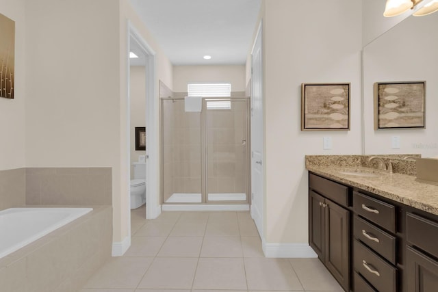 7403 Marker Ave, Kissimmee, FL 34747 - full bath featuring vanity, a shower stall, a garden tub, and tile patterned flooring
