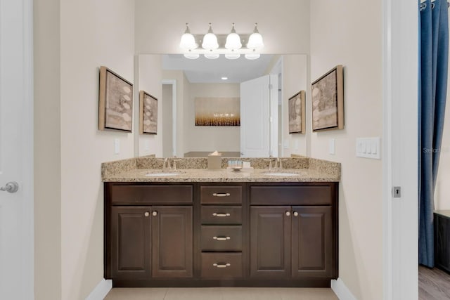 7403 Marker Ave, Kissimmee, FL 34747 - full bathroom with baseboards and double vanity