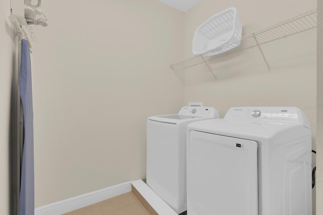 7403 Marker Ave, Kissimmee, FL 34747 - laundry room with independent washer and dryer and light tile patterned flooring