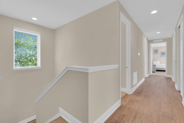 7403 Marker Ave, Kissimmee, FL 34747 - hall featuring an upstairs landing, wood finished floors, and recessed lighting