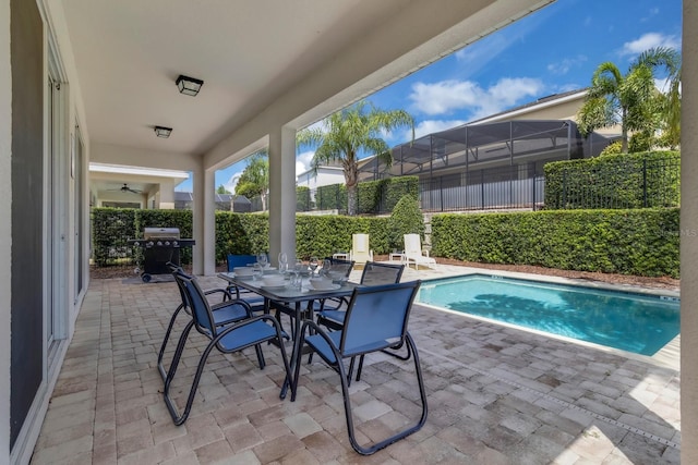 7403 Marker Ave, Kissimmee, FL 34747 - view of swimming pool featuring a patio area, a grill, and outdoor dining area