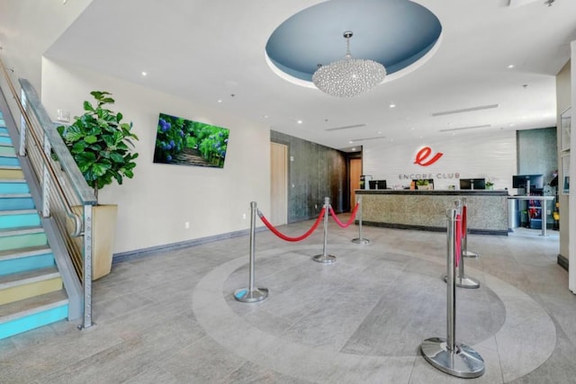 7403 Marker Ave, Kissimmee, FL 34747 - welcome area featuring recessed lighting, stairway, and a chandelier