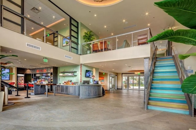 7403 Marker Ave, Kissimmee, FL 34747 - reception with a towering ceiling, stairway, and recessed lighting