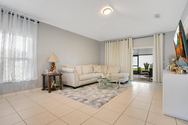 3430 Harlequin Dr, Saint Cloud, FL 34772 - living area featuring light tile patterned floors and baseboards