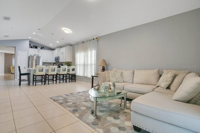 3430 Harlequin Dr, Saint Cloud, FL 34772 - living area featuring lofted ceiling, light tile patterned floors, and recessed lighting