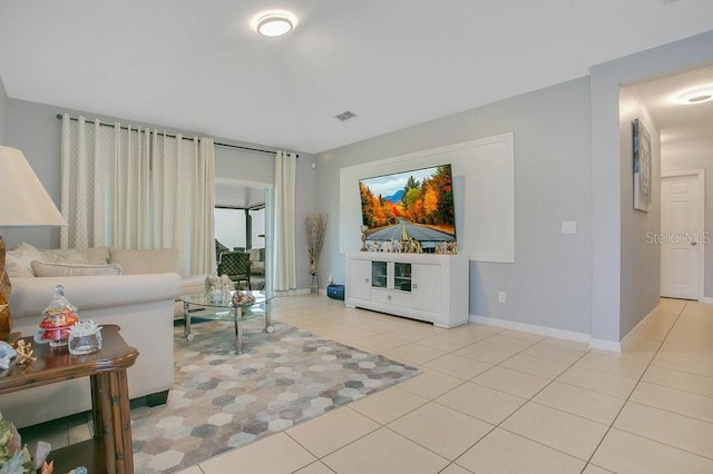 3430 Harlequin Dr, Saint Cloud, FL 34772 - tiled living room featuring baseboards