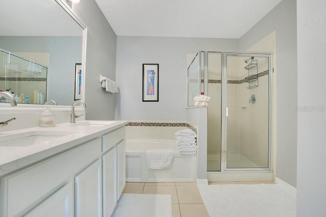 3430 Harlequin Dr, Saint Cloud, FL 34772 - full bathroom with tile patterned floors, a stall shower, a bath, and double vanity