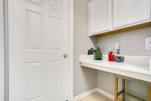 3430 Harlequin Dr, Saint Cloud, FL 34772 - bar with baseboards and light tile patterned floors