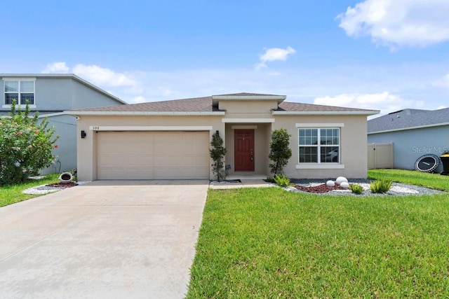 588 Meadow Bend Dr, Davenport, FL 33837 - view of front of home featuring an attached garage, stucco siding, concrete driveway, and a front yard