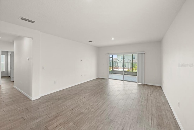 588 Meadow Bend Dr, Davenport, FL 33837 - empty room featuring light wood-type flooring and recessed lighting