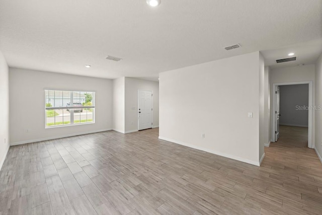 588 Meadow Bend Dr, Davenport, FL 33837 - empty room featuring light wood finished floors and recessed lighting