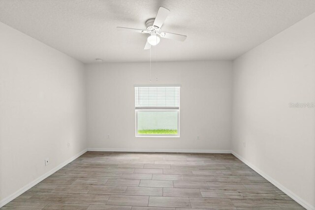 588 Meadow Bend Dr, Davenport, FL 33837 - spare room featuring ceiling fan, wood finished floors, and a textured ceiling
