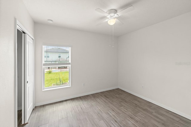 588 Meadow Bend Dr, Davenport, FL 33837 - spare room with wood finished floors, a ceiling fan, and a smoke detector